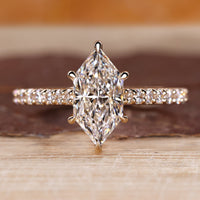 Dutch marquise diamond ring with round diamond pave style.