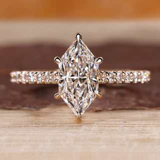 Dutch marquise diamond ring with round diamond pave style.