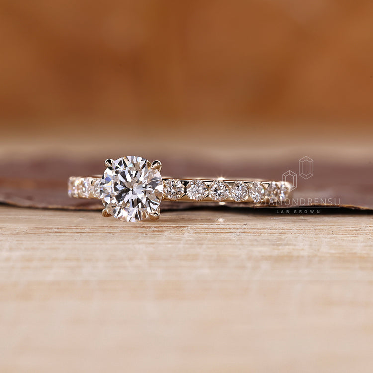Round diamond ring with secure four claw prong setting.