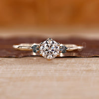 Round cut diamond ring moss agate side stones three stone.