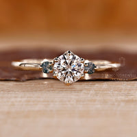 Round cut diamond ring moss agate side stones three stone.