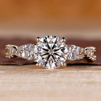 Round cut diamond ring three stone twisted shank vintage.