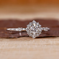 Halo round diamond ring cluster four prong style.