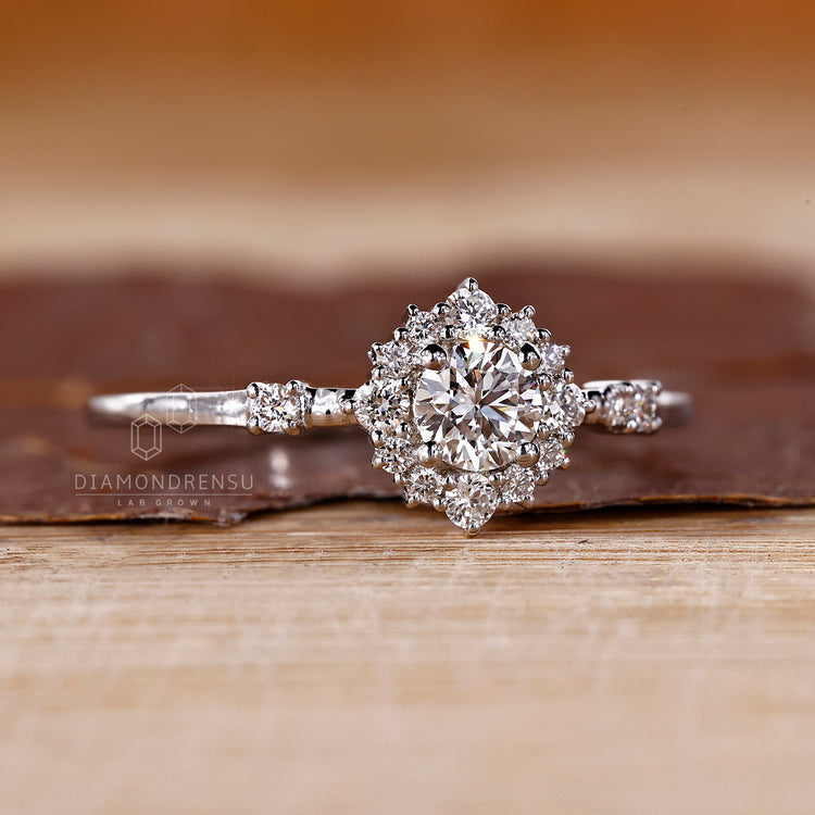 Halo round diamond ring cluster four prong style.