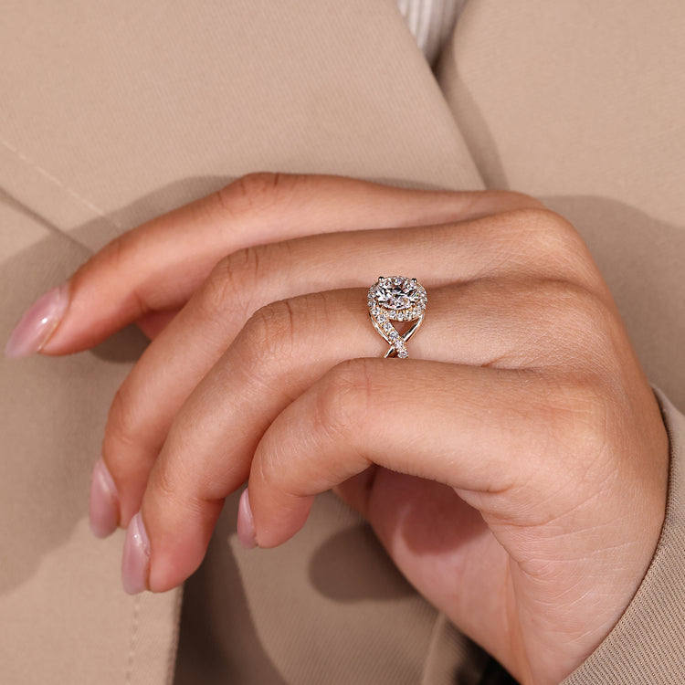 Round cut ring halo four prong twisted shank.