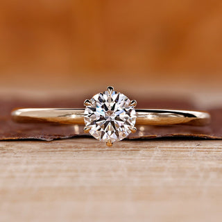 Round cut diamond ring solitaire six claw prong set.