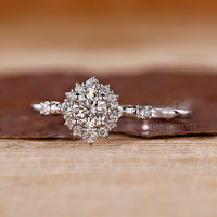 Lab grown round diamond ring halo cluster style.