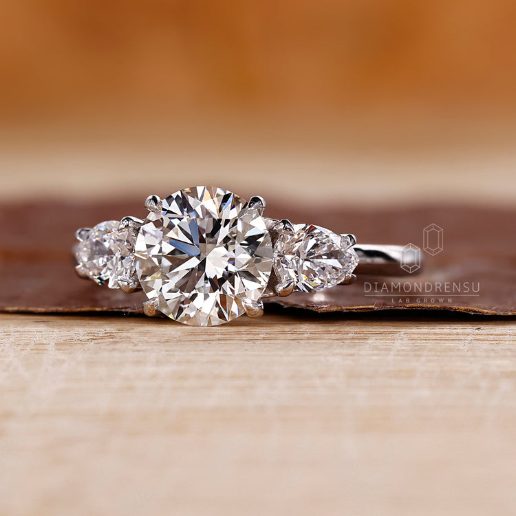 Lab grown round diamond ring three stone style.
