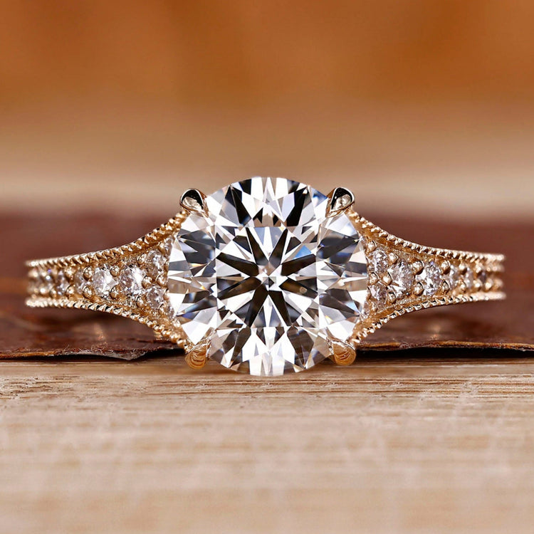 Round cut diamond ring tapered pave milgrain bridge set.