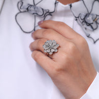 Lab grown vintage diamond ring with round side stones.