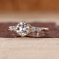 Round old European cut ring six prong five stone style.
