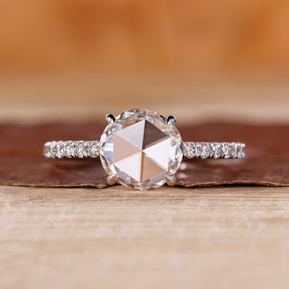 Round rose cut diamond ring with round diamond pave setting.