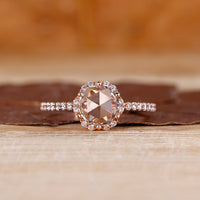 Round rose cut ring with round diamond halo and pave style.