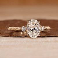 Three stone oval diamond ring tapered shank prong set.