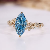 Marquise diamond ring with leaf style prong setting.
