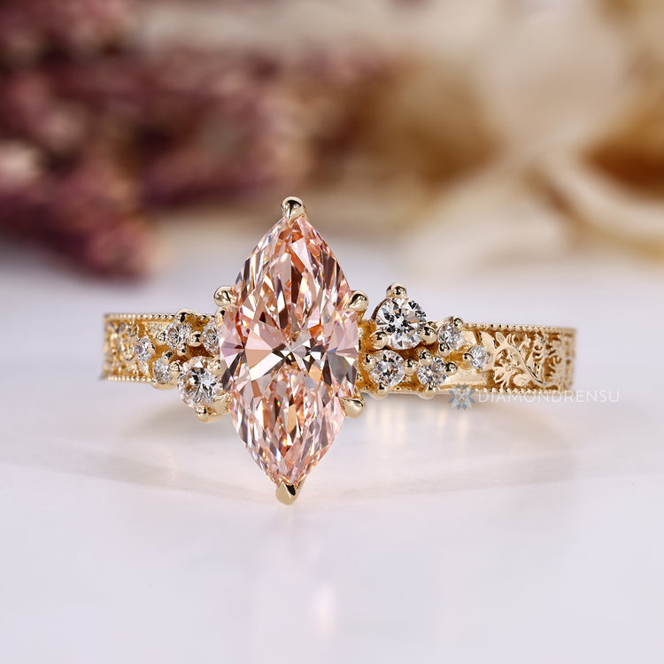 Lab grown marquise diamond ring with pink diamond.