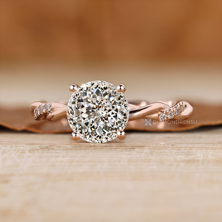 Portuguese cut diamond ring with twisted band design.