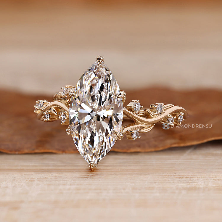 Marquise diamond ring cathedral setting.