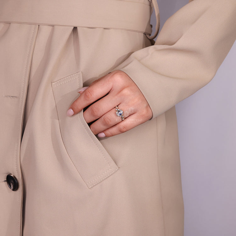 Lab grown emerald cut ring with marquise and round side stones.
