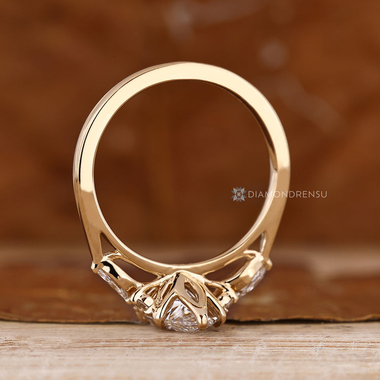 Handmade marquise ring with tulip basket and tapered shank.
