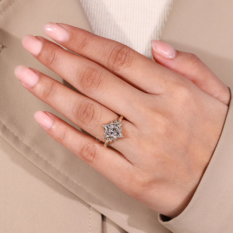 Five stone marquise cut diamond ring with six claw prong.