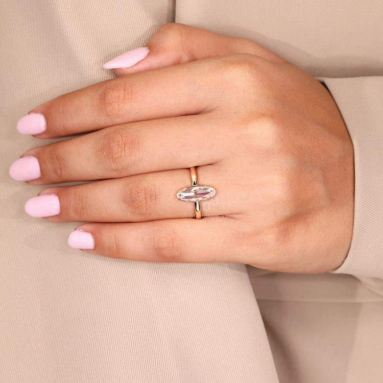 Moval rose cut ring solitaire double claw prong set.