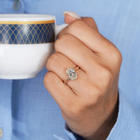 Lab grown oval diamond ring with milgrain details.
