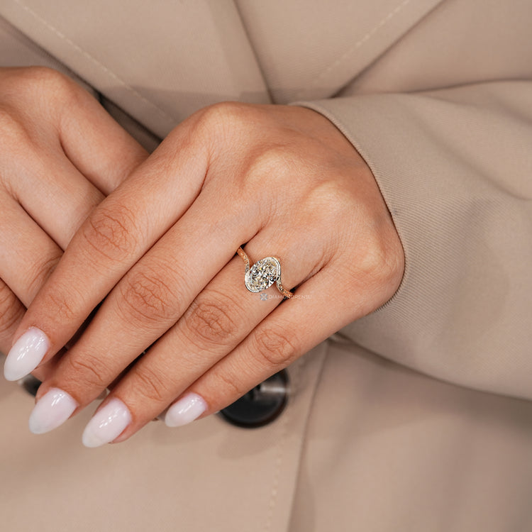 Lab grown oval diamond ring with bypass setting.
