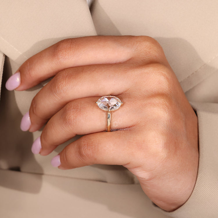 Oval rose diamond ring compass claw prong setting.