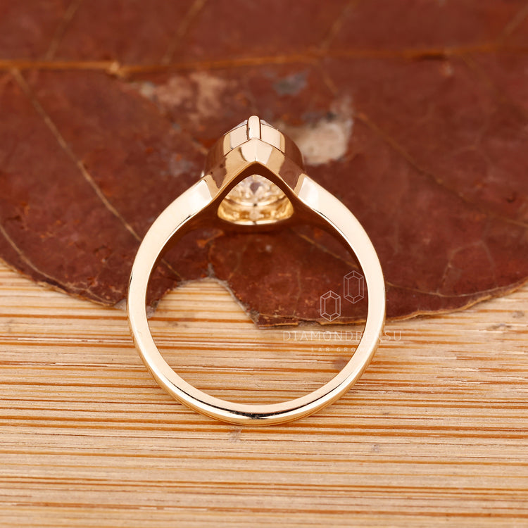 IGI certified pear diamond ring three claw prong.