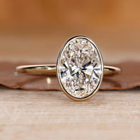 Handmade oval diamond ring with solitaire setting.