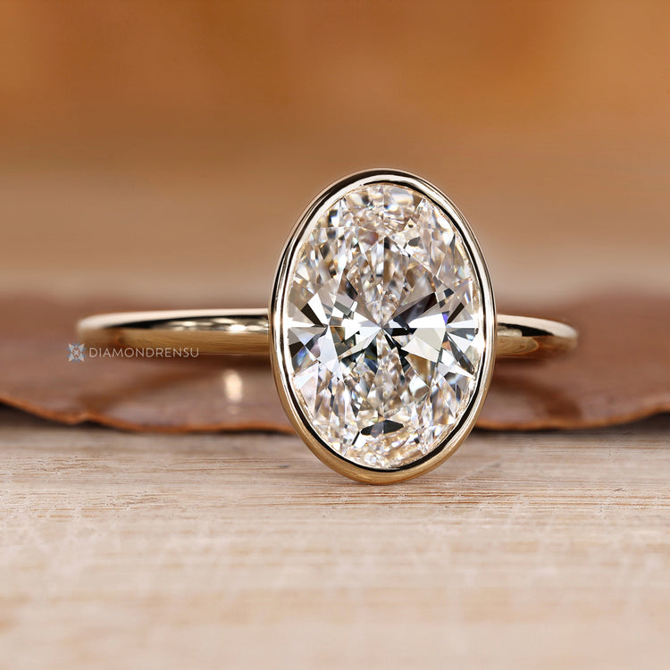 Handmade oval diamond ring with solitaire setting.
