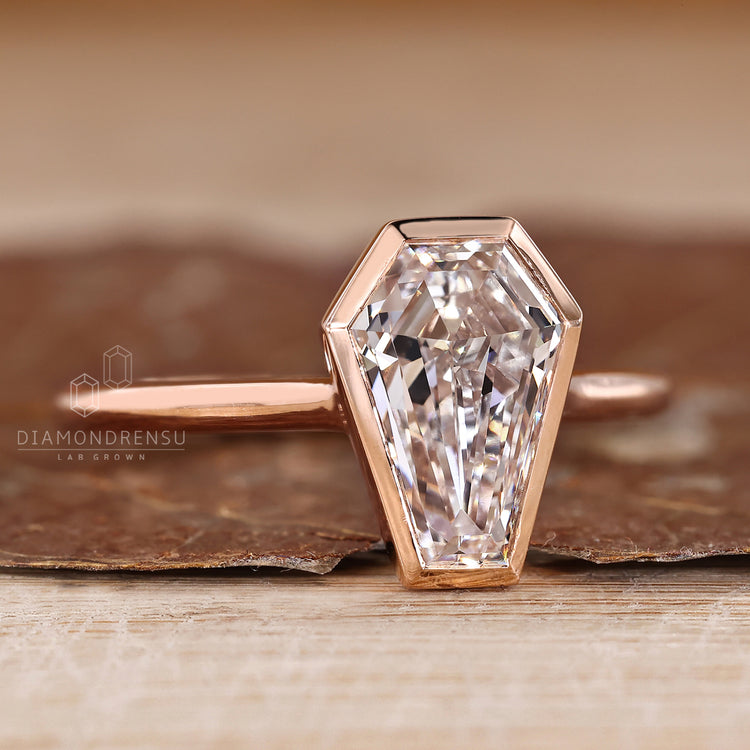 Solitaire coffin diamond ring bezel setting.