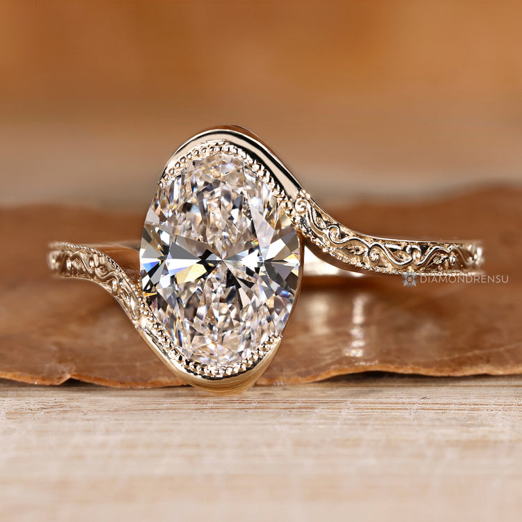 Oval cut solitaire diamond ring with bypass setting.