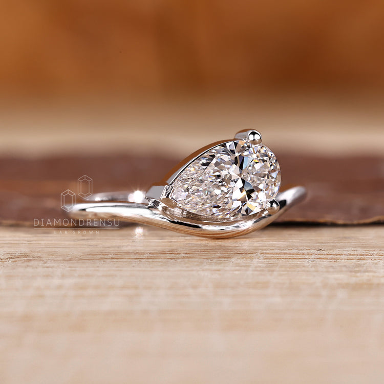 IGI certified pear diamond ring in east to west style.