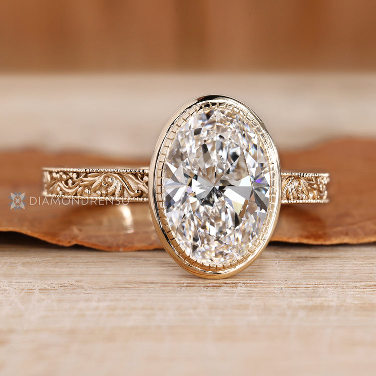 Oval cut diamond ring with cathedral setting.
