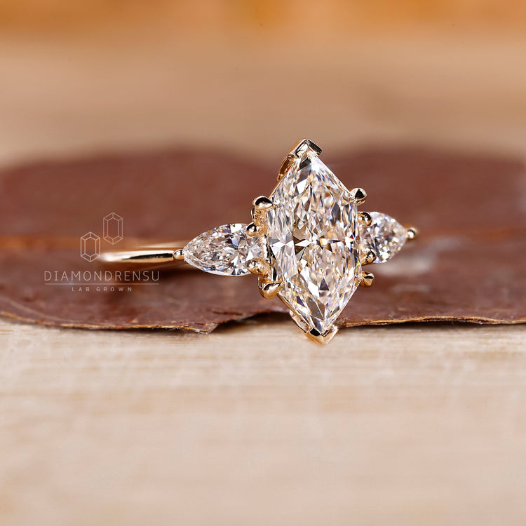 Marquise diamond ring v prong tapered shank style.
