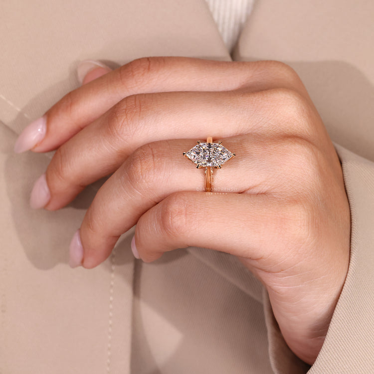 Hidden halo Dutch marquise ring with round diamonds.