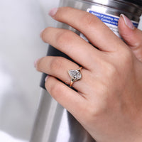 Pear cut ring solitaire bezel type prong setting.
