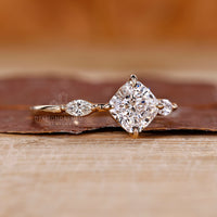 Three stone cushion diamond ring marquise side stones.