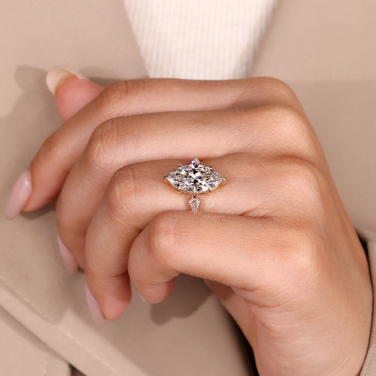 Tapered shank ring with marquise diamond and hidden halo.