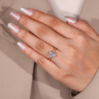 Oval cut diamond ring six claw prong tapered shank.