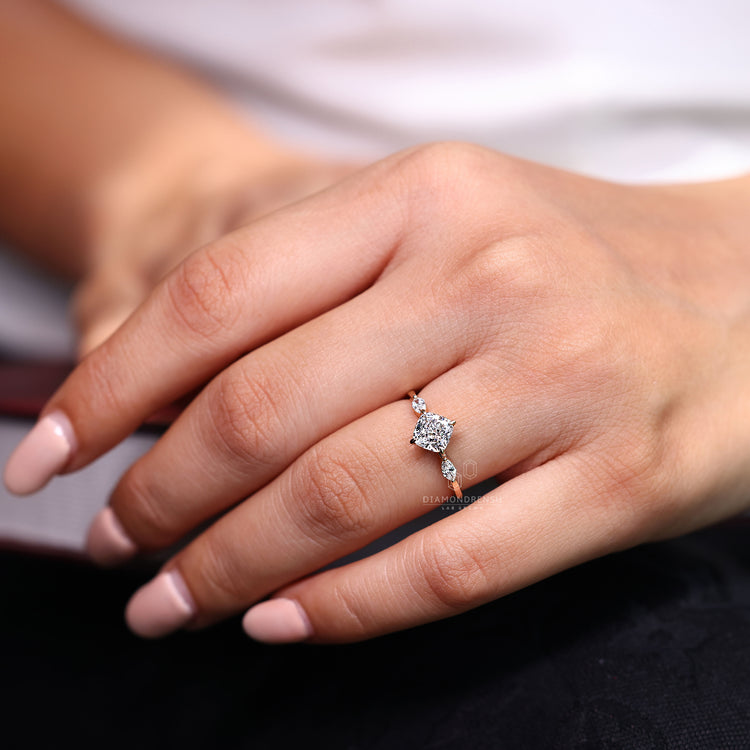 Cushion cut ring compass prong three stone marquise style.