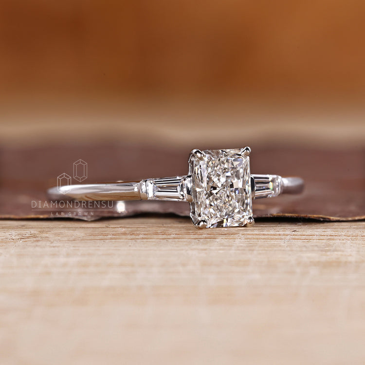 Three stone radiant diamond ring baguette side stones.