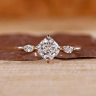 Cushion cut diamond ring marquise side stones three stone.