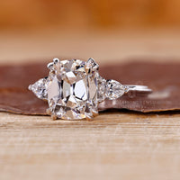 Handmade Cushion Old European Cut ring with pear stones.