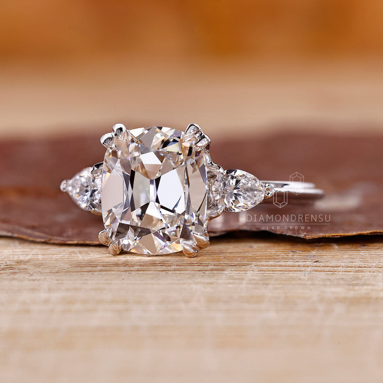 Handmade Cushion Old European Cut ring with pear stones.