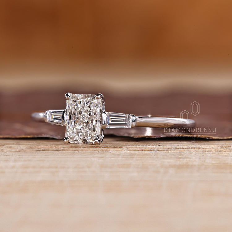 Lab grown radiant diamond ring baguette three stone.
