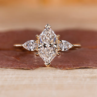 Dutch marquise diamond ring pear side stones three stone.