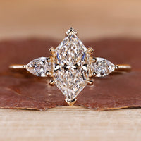 Dutch marquise diamond ring pear side stones three stone.